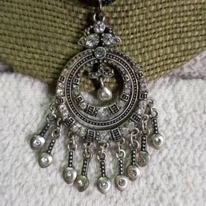 Silvertone crystal Premier designs pendant on black cord